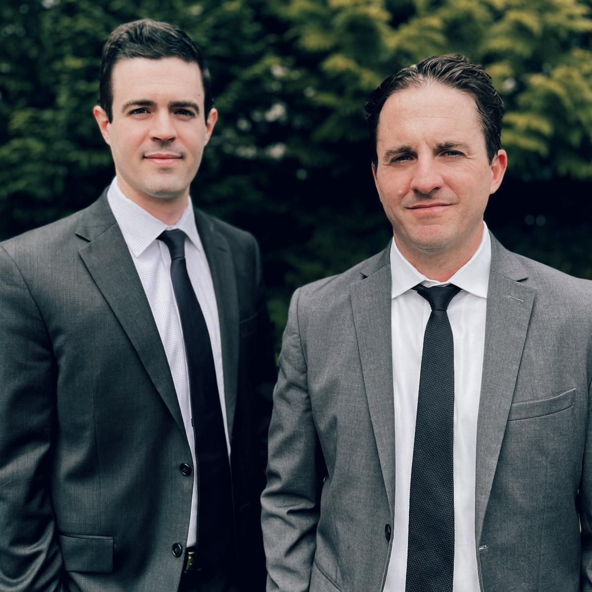 Attorneys Dan McLafferty & Jesse Froehling standing side-by-side